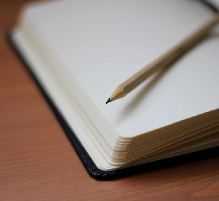 cd354a4bbe1df8542233b1bfcc85f556.jpg notebook with blank pages and pencil